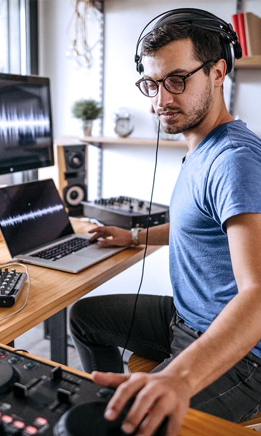 A photographer works at a computer in her studio.