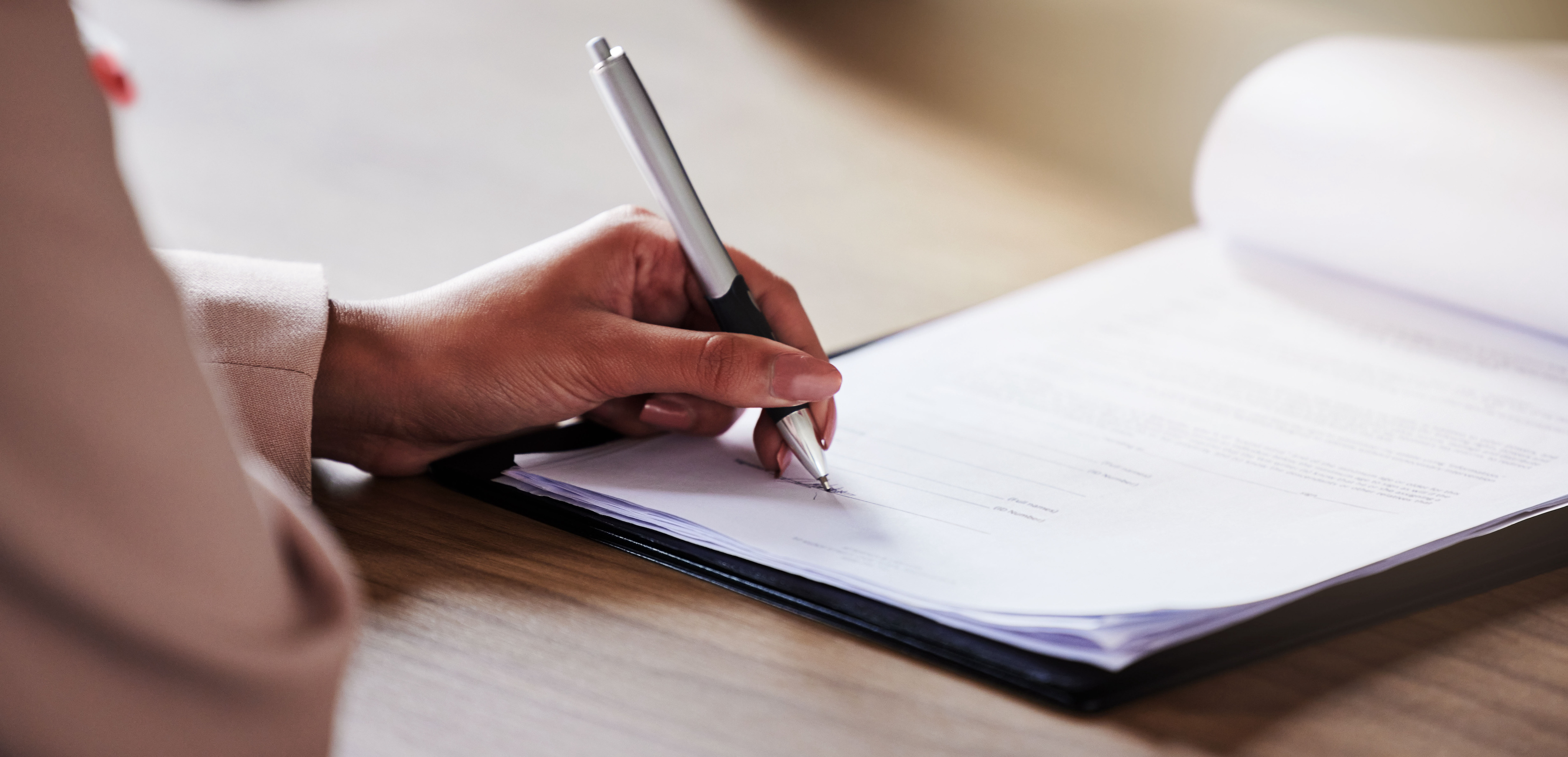 By registering your domain name, you can protect your brand's online presence and facilitate your marketing efforts. This woman writes ideas down before checking online.
